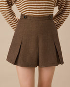 Brown Striped Pleated Mini Skirt" can be rewritten as "Striped Mini Skirt with Pleats in Brown.