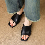 Virelle Curve Leder Mules mit Absatz