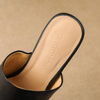 Virelle Curve Leder Mules mit Absatz