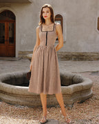 Brown Plaid Sleeveless Midi Dress" can be rewritten as "Sleeveless Midi Dress in Brown Plaid" or "Brown Plaid Midi Dress Without Sleeves.