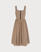 Brown Plaid Sleeveless Midi Dress" can be rewritten as "Sleeveless Midi Dress in Brown Plaid" or "Brown Plaid Midi Dress Without Sleeves.