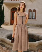 Brown Plaid Sleeveless Midi Dress" can be rewritten as "Sleeveless Midi Dress in Brown Plaid" or "Brown Plaid Midi Dress Without Sleeves.