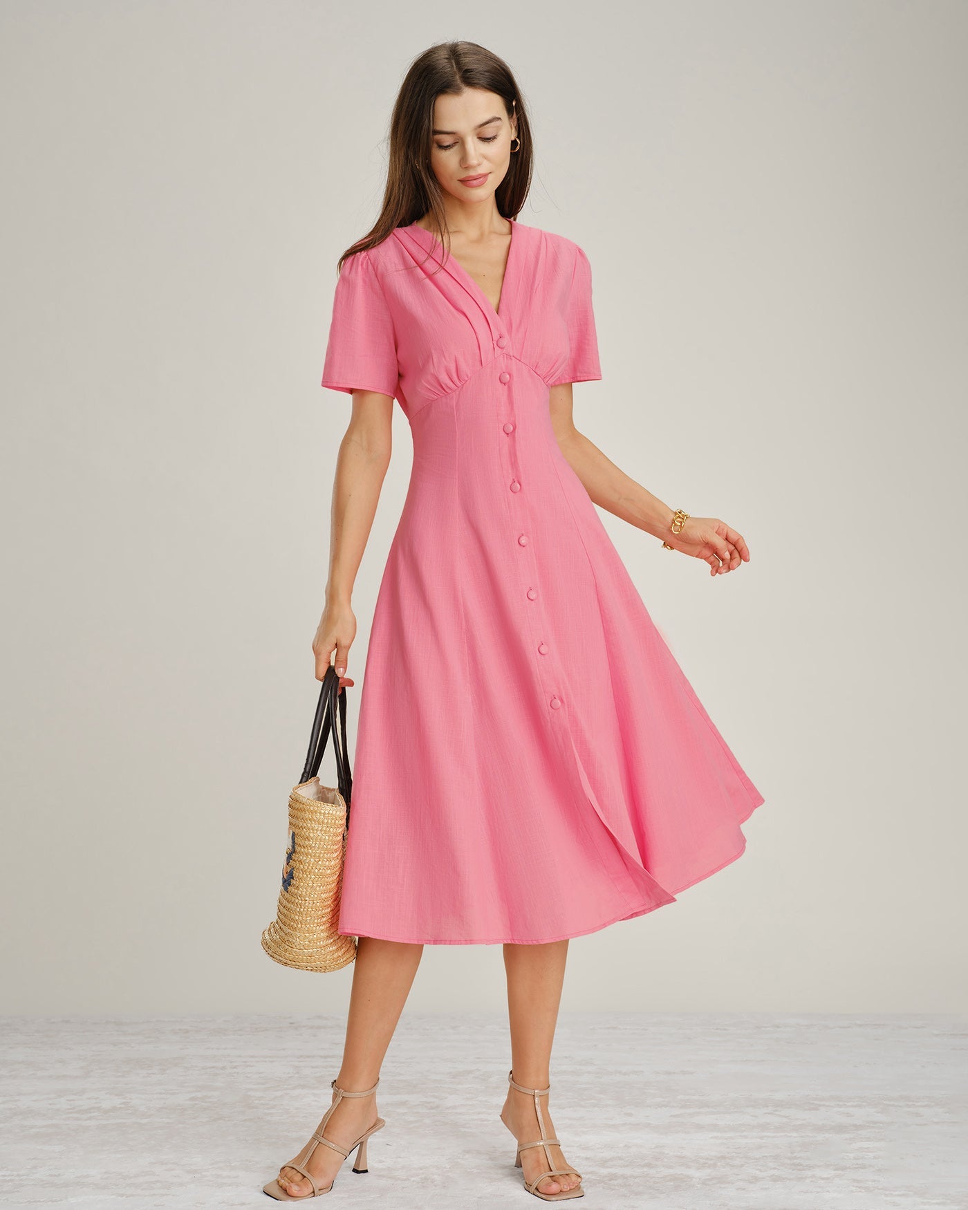 Pink V-Neck Midi Dress with Ruched Detailing and Button Accents