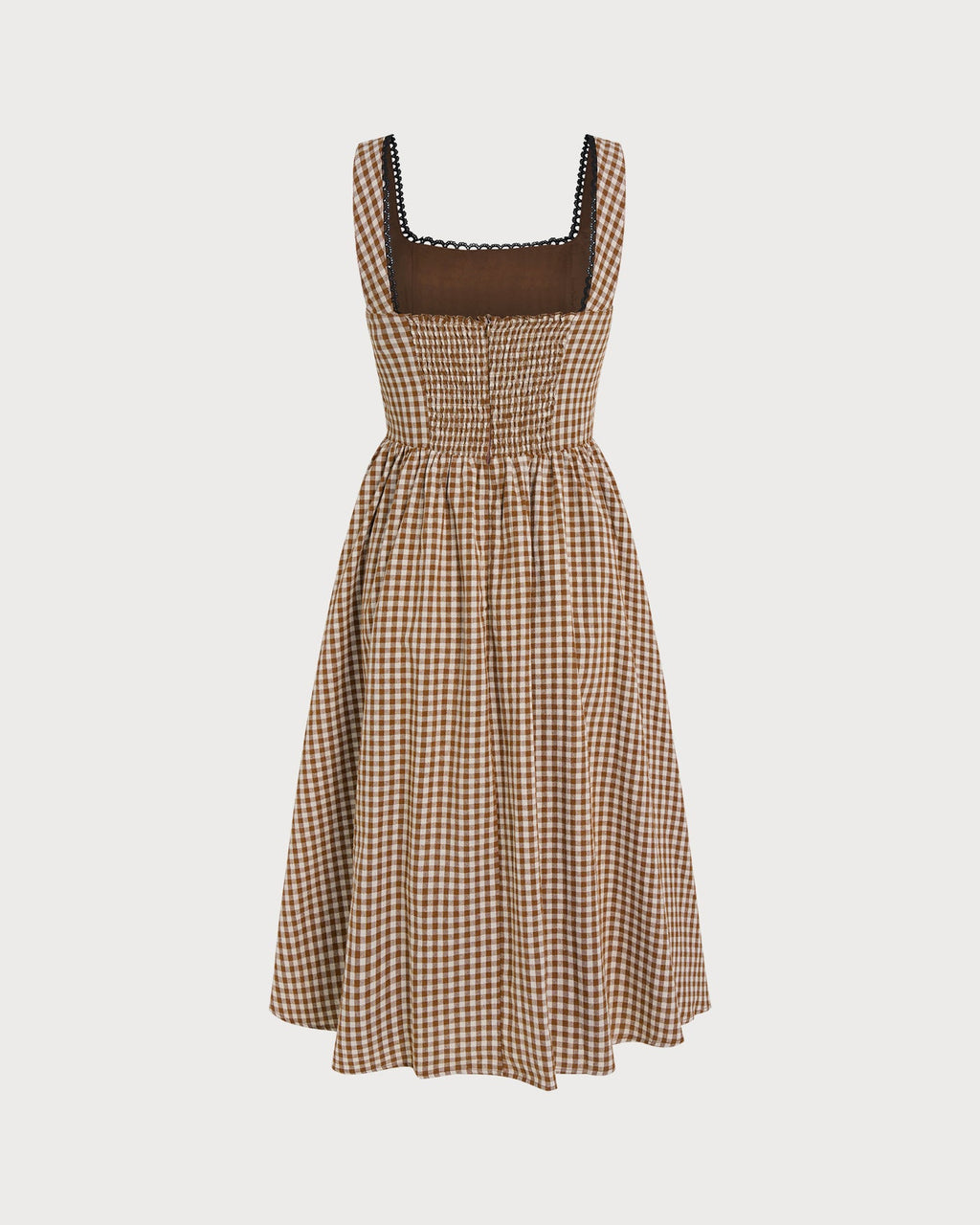 Brown Plaid Sleeveless Midi Dress" can be rewritten as "Sleeveless Midi Dress in Brown Plaid" or "Brown Plaid Midi Dress Without Sleeves.