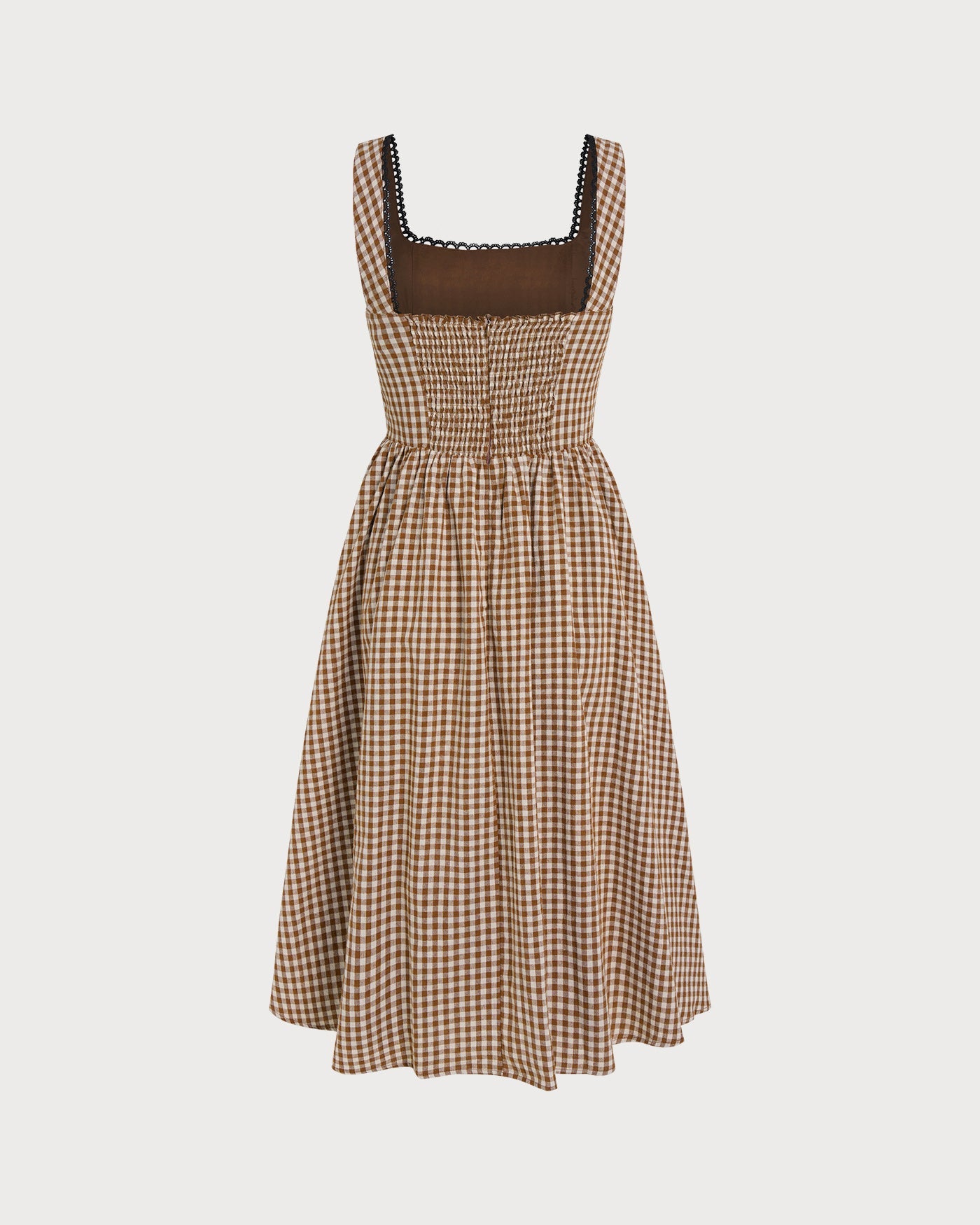 Brown Plaid Sleeveless Midi Dress" can be rewritten as "Sleeveless Midi Dress in Brown Plaid" or "Brown Plaid Midi Dress Without Sleeves.