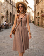 Brown Plaid Sleeveless Midi Dress" can be rewritten as "Sleeveless Midi Dress in Brown Plaid" or "Brown Plaid Midi Dress Without Sleeves.
