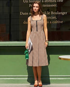 Brown Plaid Sleeveless Midi Dress" can be rewritten as "Sleeveless Midi Dress in Brown Plaid" or "Brown Plaid Midi Dress Without Sleeves.