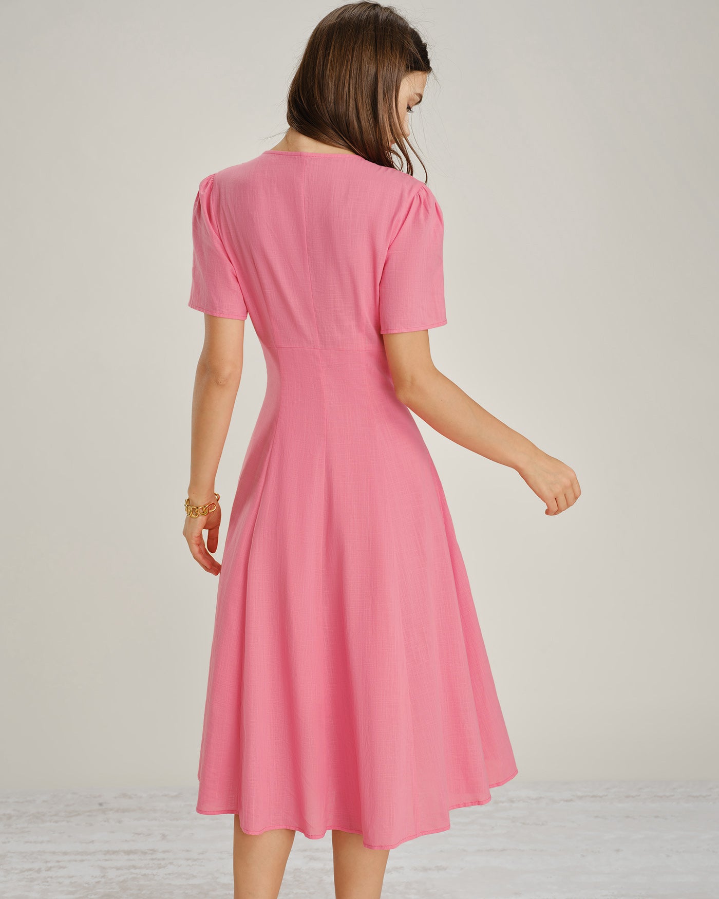 Pink V-Neck Midi Dress with Ruched Detailing and Button Accents