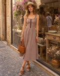 Brown Plaid Sleeveless Midi Dress" can be rewritten as "Sleeveless Midi Dress in Brown Plaid" or "Brown Plaid Midi Dress Without Sleeves.
