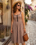 Brown Plaid Sleeveless Midi Dress" can be rewritten as "Sleeveless Midi Dress in Brown Plaid" or "Brown Plaid Midi Dress Without Sleeves.