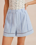 Cut-Out Zipper Shorts with Blue Button Detail