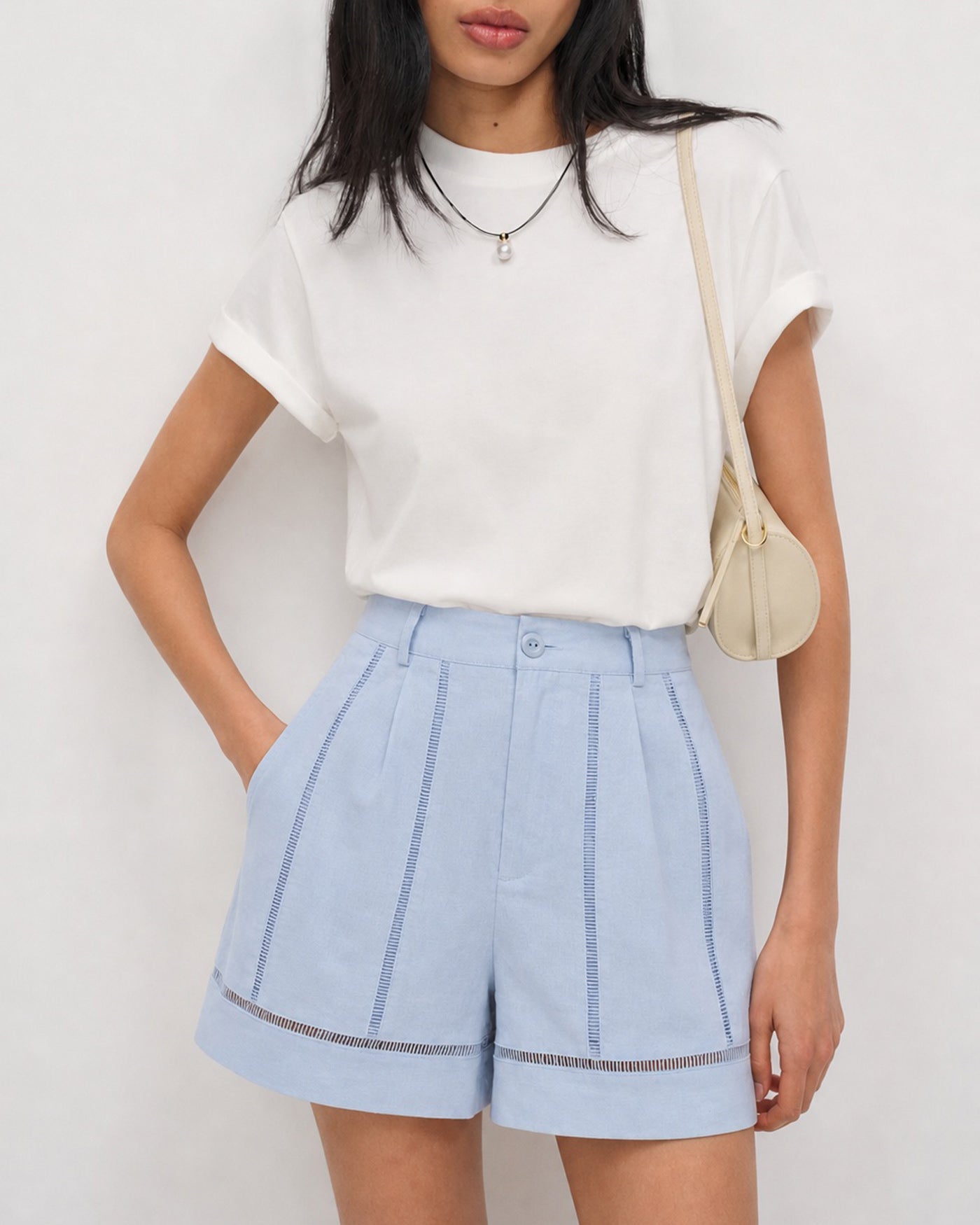 Cut-Out Zipper Shorts with Blue Button Detail